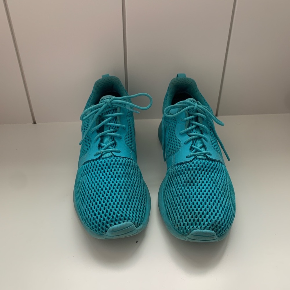 Used blue Nike athletic shoes